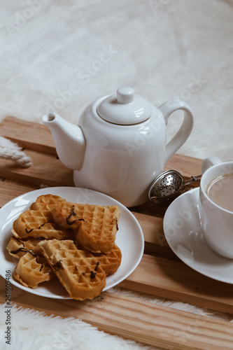 Wallpaper Mural Cozy breakfast in bed, cup of coffee and heart shaped waffles on wooden tray on white and gray cozy blanket, the concept of home comfort, copy space Torontodigital.ca