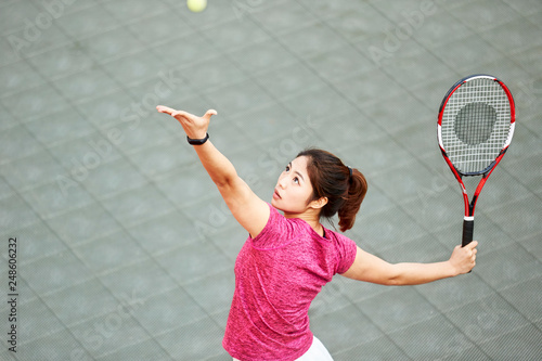 young asian girl playing tennis © imtmphoto