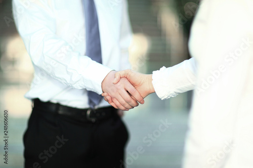 closeup .the handshake of a businessman and business woman.