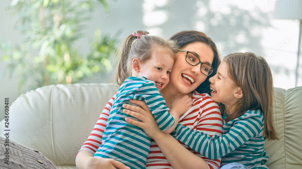 mother and daughters playing