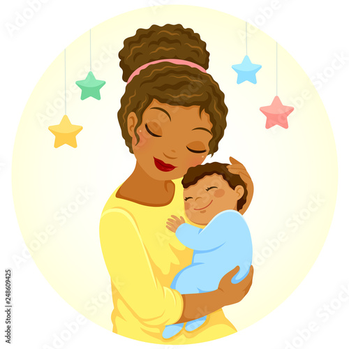 Young mother of black ethnicity hugging a smiling baby boy