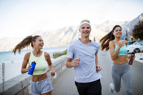Friends fitness training together outdoors living active healthy