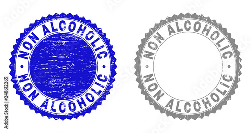 Grunge NON ALCOHOLIC stamp seals isolated on a white background. Rosette seals with grunge texture in blue and gray colors. Vector rubber stamp imitation of NON ALCOHOLIC label inside round rosette.