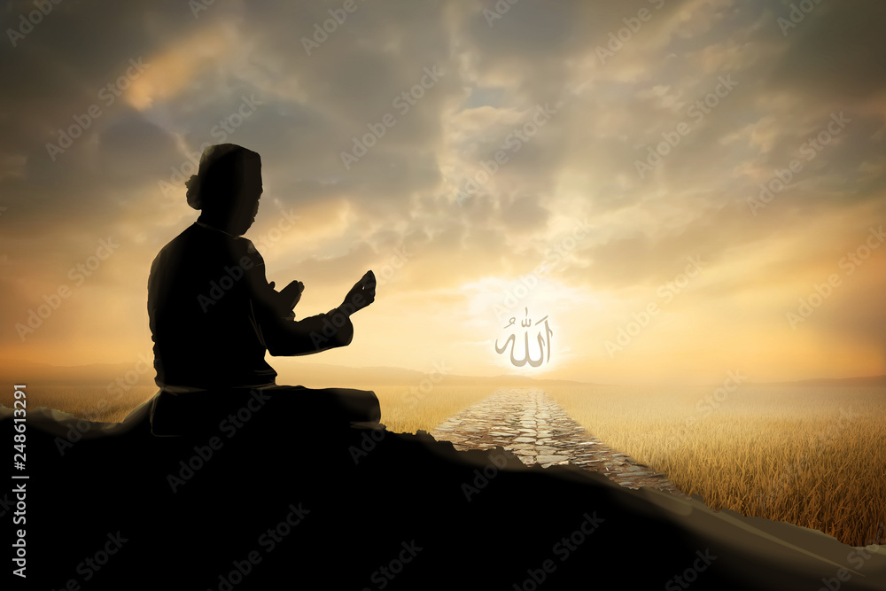 Silhouettes Muslim prayer,the light of faith, hope, faith, supplication,Concept of Islam is the religion, Young Muslim man praying mosque blurred background 