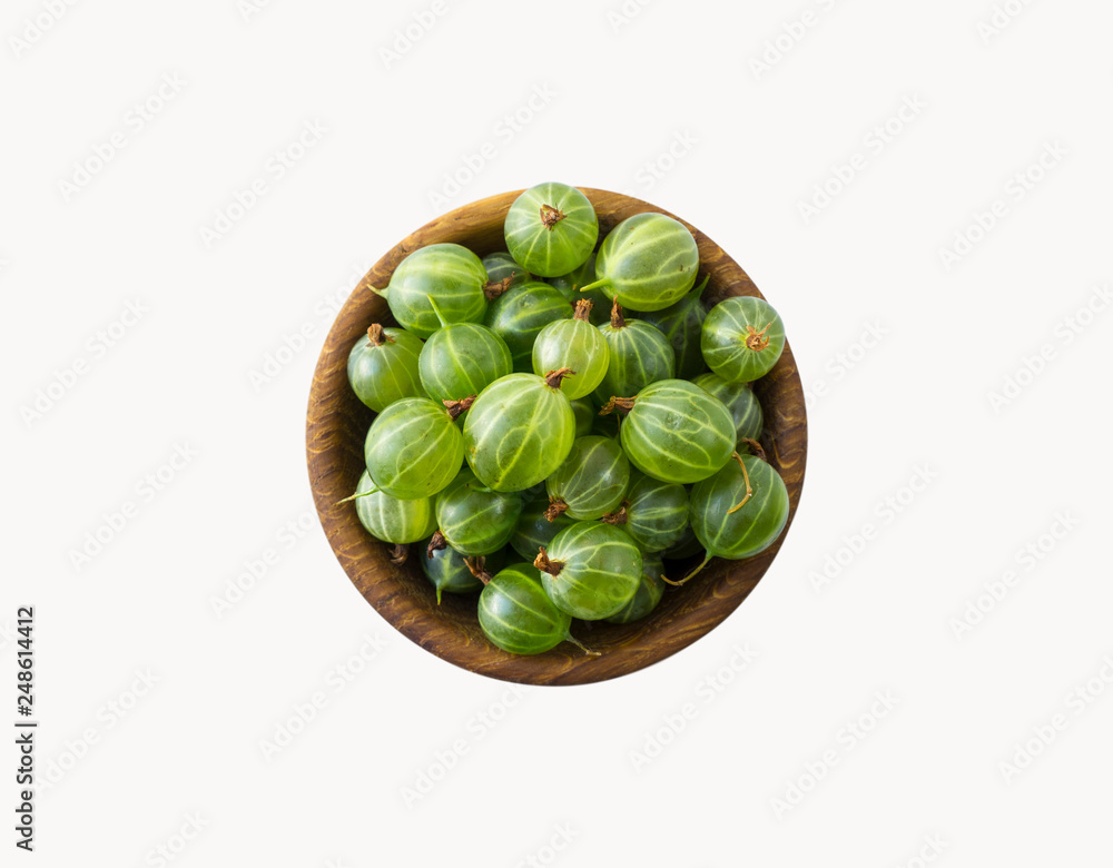 Gooseberries fruits isolated on white background. Gooseberries in a bowl with copy space for text. Ripe gooseberry close-up. Background berry. Sweet and juicy berry. Top view. Gooseberries fruits isolated on white background. Gooseberries in a bowl with copy space for text. Ripe gooseberry close-up. Background berry. Sweet and juicy berry. Top view.