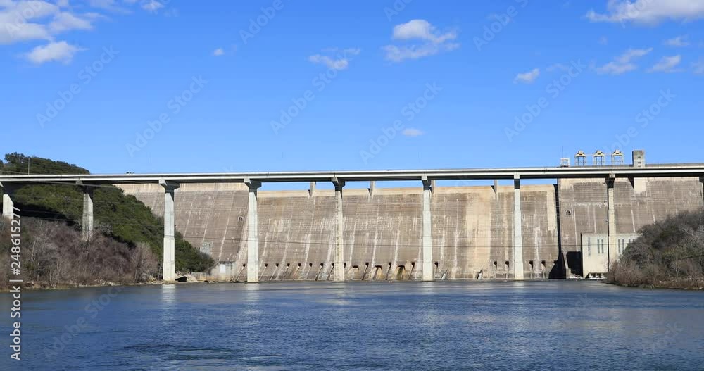 Austin Texas Mansfield Dam Colorado River bridge. Dam located across the Colorado River, 13 miles northwest of Austin, Texas. Lower Colorado River Authority ( LCRA ) and the Bureau of Reclamation. Austin Texas Mansfield Dam Colorado River bridge. Dam located across the Colorado River, 13 miles northwest of Austin, Texas. Lower Colorado River Authority ( LCRA ) and the Bureau of Reclamation.