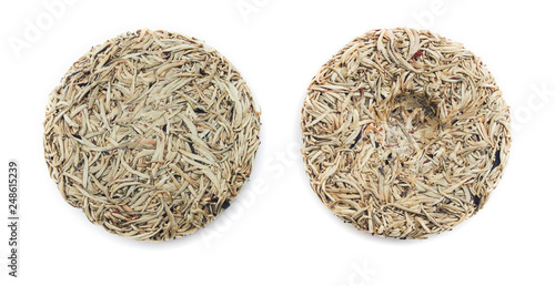 Front and back view of white raw puer cake, from Yunnan, China. Isolated on white.
