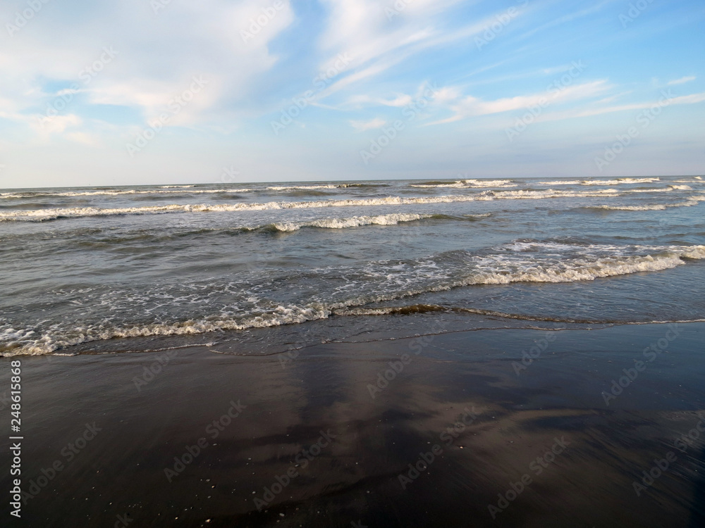Waves on a sandy beach, Adriatic coast, Rimini, Italy. Waves on a sandy beach, Adriatic coast, Rimini, Italy.