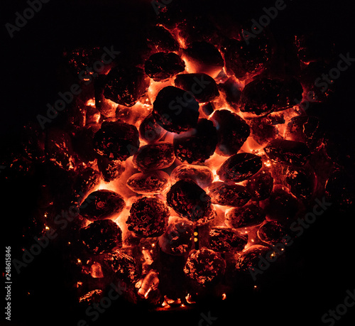 Glowing Hot Charcoal Briquettes on garden grill, close-Up, Top View
