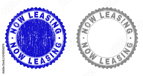 Grunge NOW LEASING stamp seals isolated on a white background. Rosette seals with grunge texture in blue and grey colors. Vector rubber watermark of NOW LEASING tag inside round rosette.