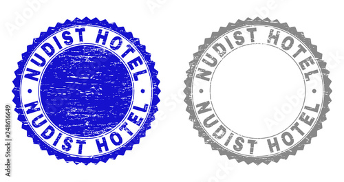 Grunge NUDIST HOTEL stamp seals isolated on a white background. Rosette seals with grunge texture in blue and gray colors. Vector rubber stamp imitation of NUDIST HOTEL label inside round rosette.