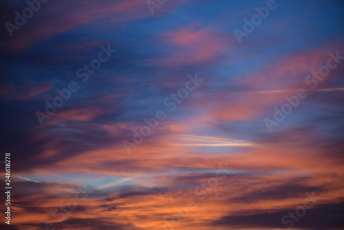 Fototapeta Naklejka Na Ścianę i Meble -   Sunset sky with clouds. Golden sunlight  for your idea of web header. Cloudy landscape for background in serenity colors - blue, violet, yellow and pink tone.