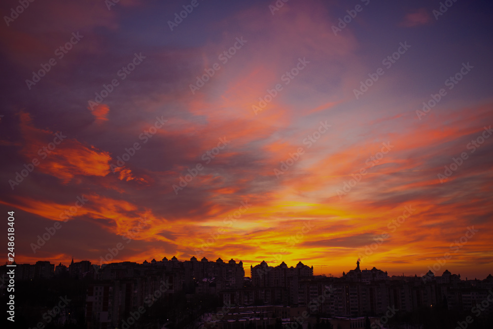  Sunset sky with clouds. Golden sunlight  for your idea of web header. Cloudy landscape for background in serenity colors - blue, violet, yellow and pink tone.
