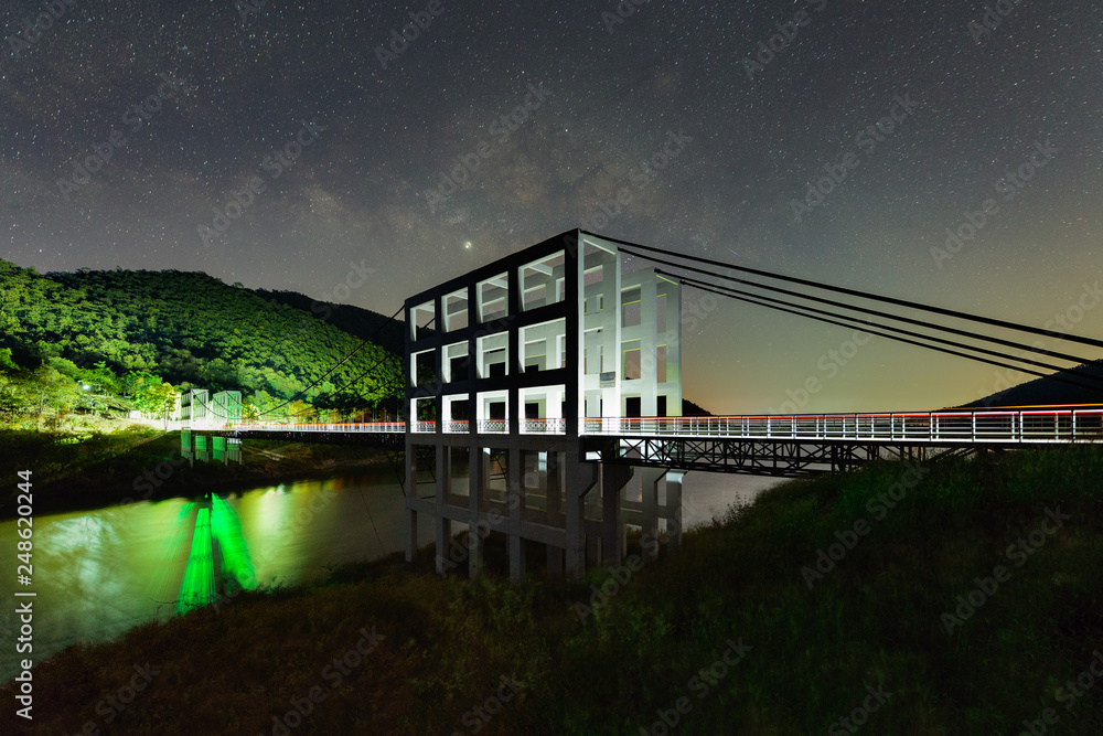 Fototapeta premium The twin white suspension bridge at Mae Kuang Dam or Mae Kuang Udom Thara dam the landmark in Doi Saket ,Chiang Mai, Thailand.