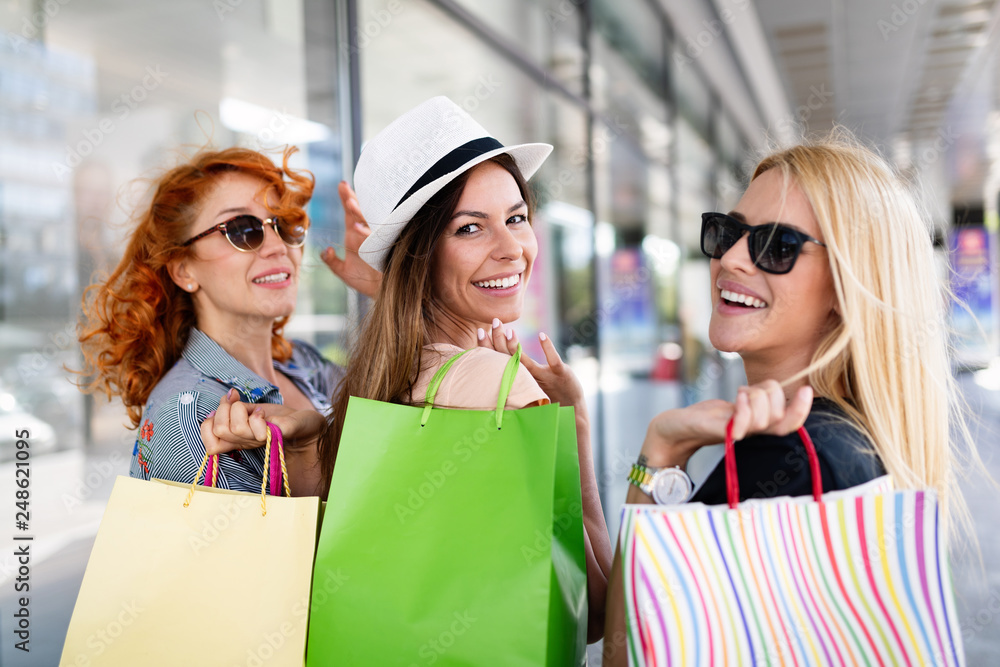 Beautiful women with shopping bags walking at the mall Beautiful women with shopping bags walking at the mall