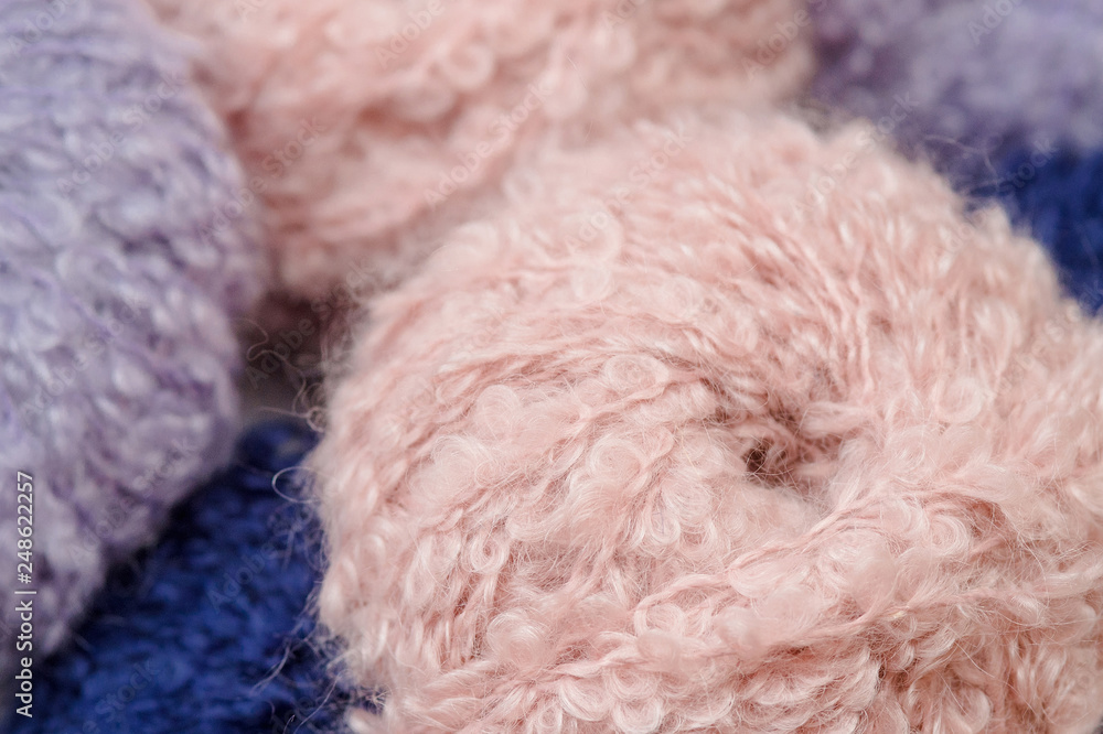Skeins of multicolored wool yarn close up Skeins of multicolored wool yarn close up