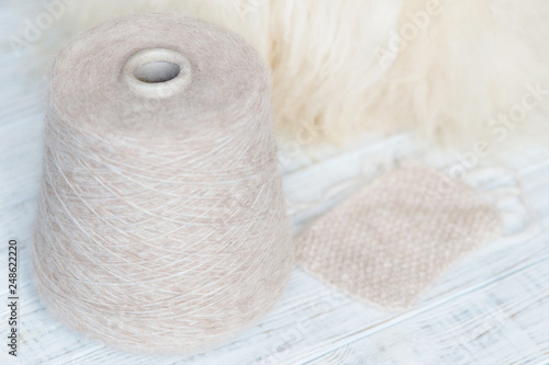 Skein of natural threads on the background of fur