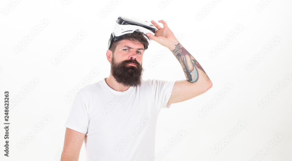 Man wearing virtual reality goggles in white background. Funny man experiencing 3D gadget technology - close up. VR headset. Man wearing virtual reality goggles in white background. Funny man experiencing 3D gadget technology - close up. VR headset.