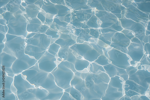 Fototapeta Naklejka Na Ścianę i Meble -  Surface of blue swimming pool texture, background of water in swimming pool