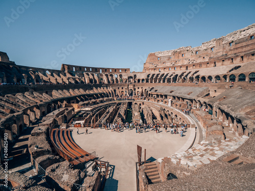 Collosseum in Rome, Italy with many tourists on a beautiful sunny day