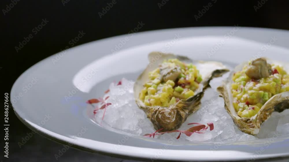 Fresh raw open oysters on ice in restaurant Fresh raw open oysters on ice in restaurant