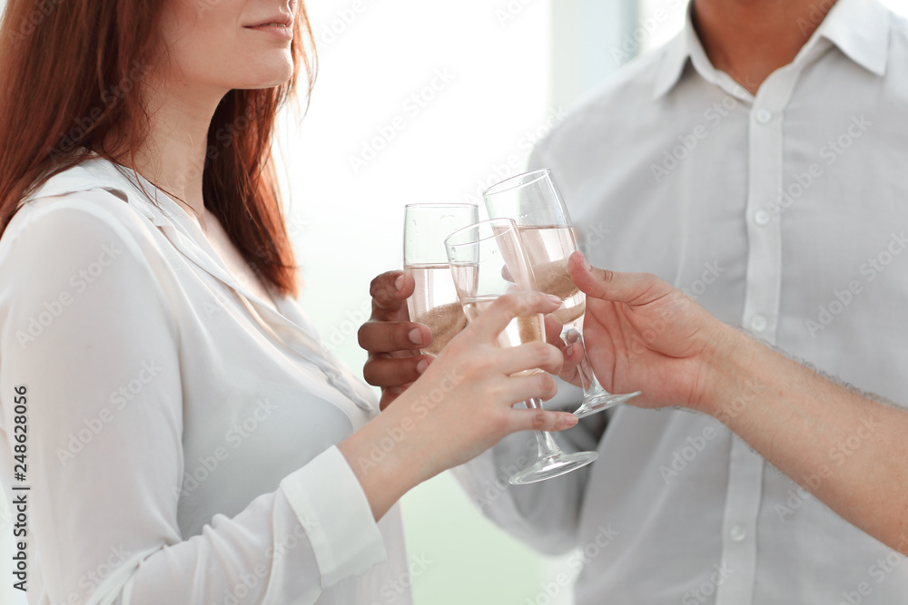 close up. glasses of wine in the hands of the business team. close up. glasses of wine in the hands of the business team.