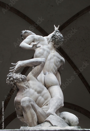 Rape of the Sabines sculpture by Giambologna in Loggia dei Lanzi, Signoria square, Florence, Italy photo