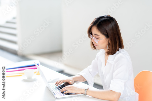 Happy business woman working in a office