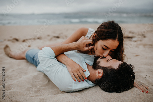 Young couple kissing on beach