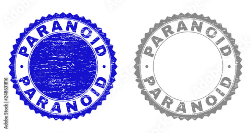 Grunge PARANOID stamps isolated on a white background. Rosette seals with grunge texture in blue and gray colors. Vector rubber stamp imprint of PARANOID label inside round rosette.