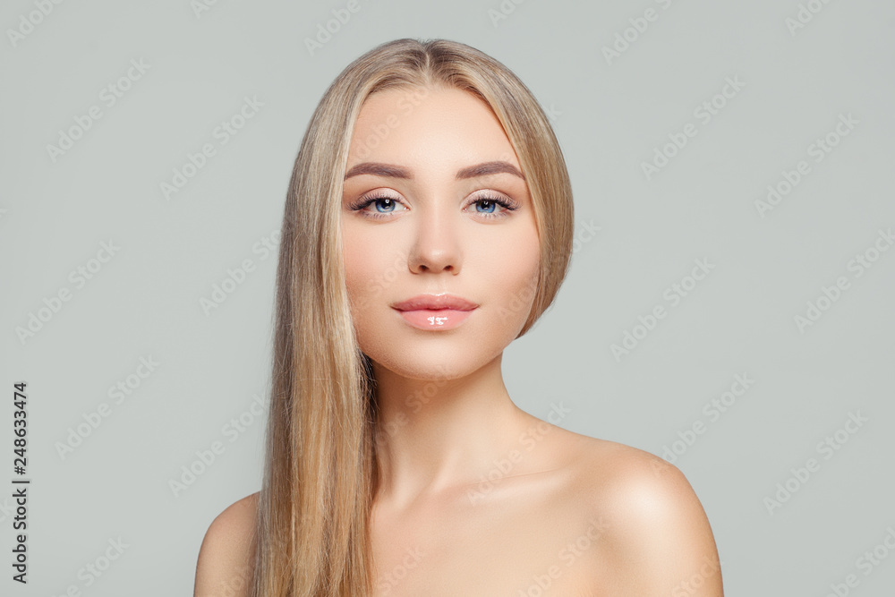 Healthy blonde woman portrait. Beauty girl with long healthy blond hair and perfect clear skin. Natural beauty Healthy blonde woman portrait. Beauty girl with long healthy blond hair and perfect clear skin. Natural beauty