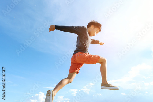 Young boy run and jump