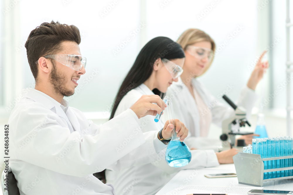 group of scientists conduct research in the laboratory group of scientists conduct research in the laboratory