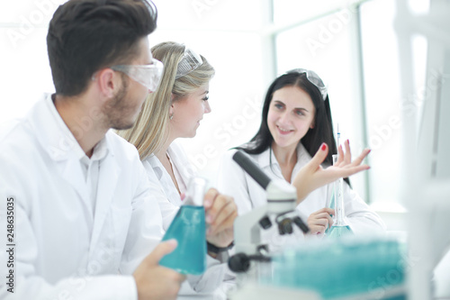 rear view.a group of scientists working in a modern laboratory