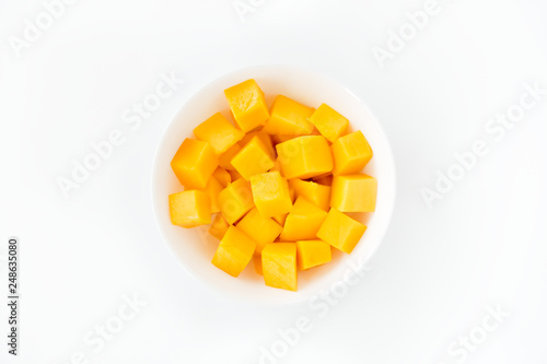 Mango Cubes in a Bowl Isolated over White