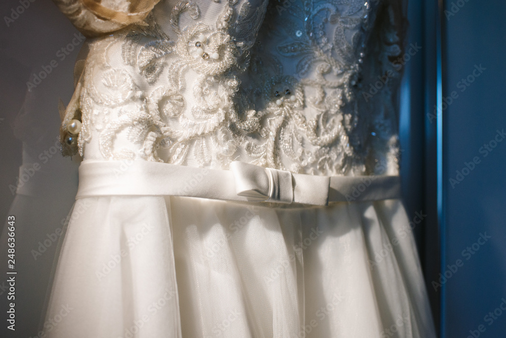 Beautiful tender wedding dress on wedding day close up
