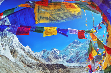 View of Mount Everest and Nuptse  with buddhist prayer flags from kala patthar in Sagarmatha National Park in the Nepal Himalaya