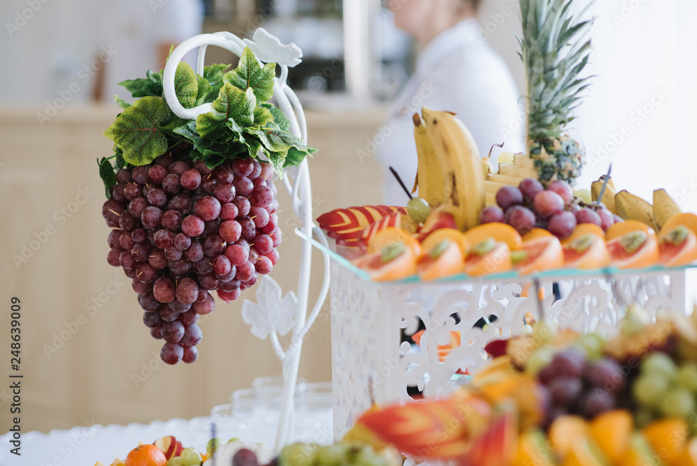 Wedding buffet table with different variety of fresh fruits Wedding buffet table with different variety of fresh fruits
