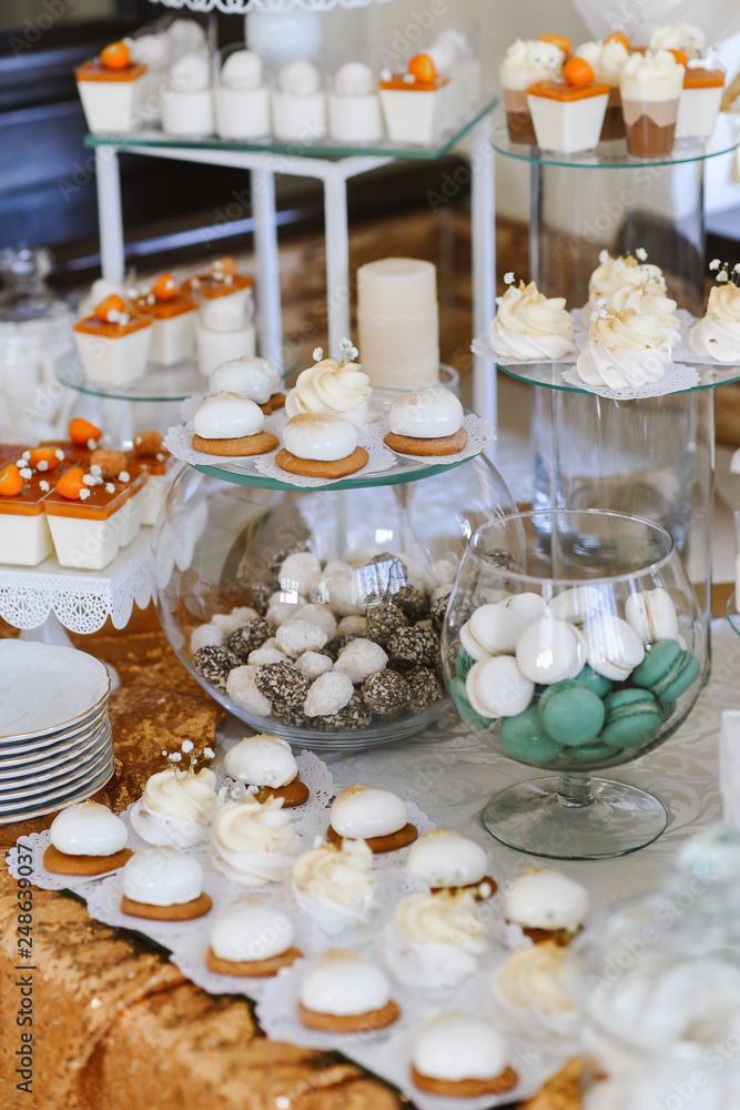 Variety of candies, cakes and cupcakes at the candy bar