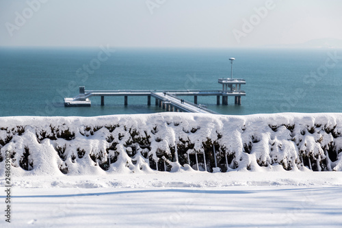 Bridge in Burgas Bulgaria in winter time. panorama of a bridge in the sea snow-covered, icy and very beautiful. seascape.