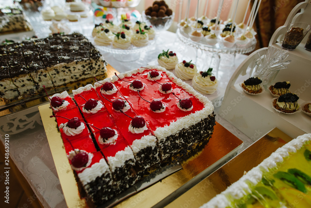 Variety of candies, cakes and cupcakes at the candy bar