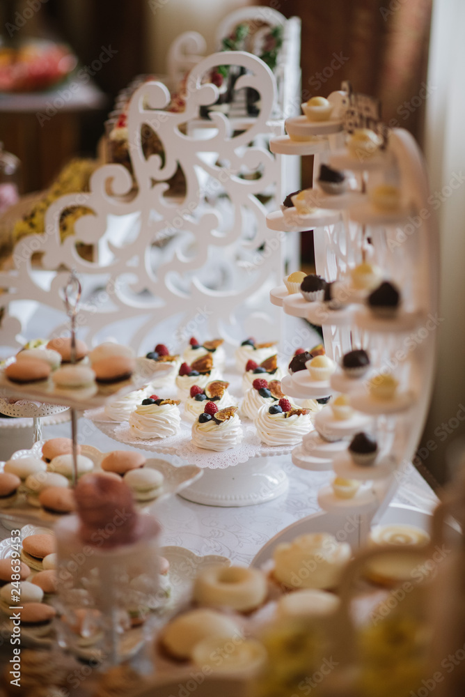 Variety of candies, cakes and cupcakes at the candy bar Variety of candies, cakes and cupcakes at the candy bar