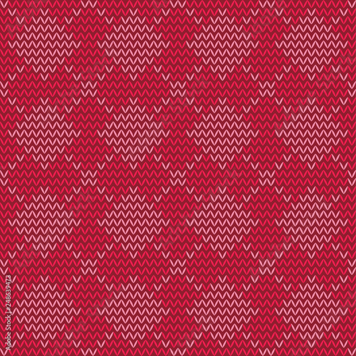 Knitted repeating ornament  rhombuses on a red background.