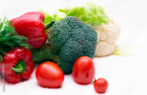 Various vegetables close to a white background