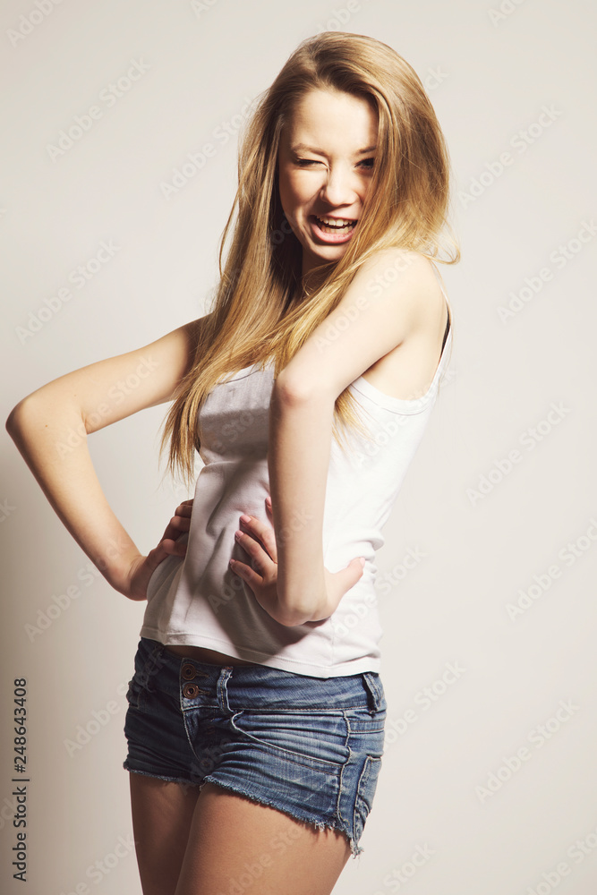 Beautiful girl posing for photo in home studio Beautiful girl posing for photo in home studio