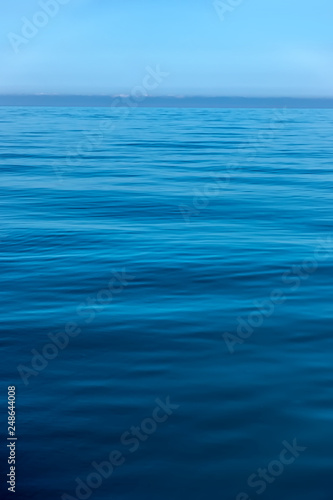 Calm Sea Ocean And Blue Sky Vertical Background