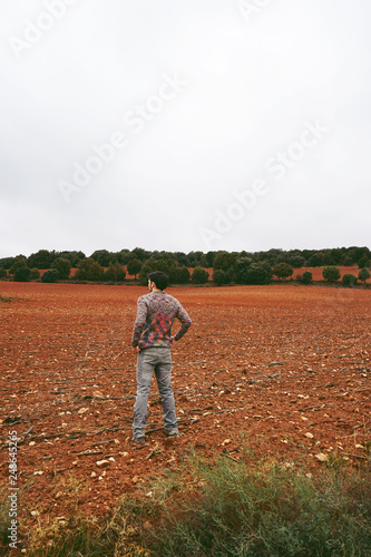 Young man alone and sad in nature