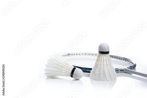 Close up shuttlecock and badminton racket on white background