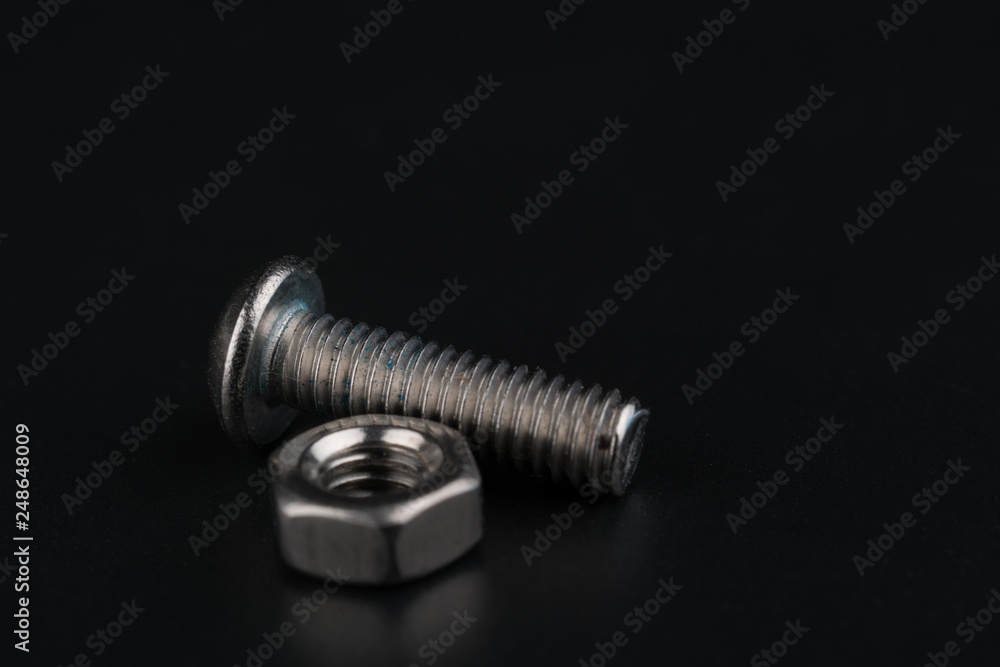 Screw and bolts on black background Screw and bolts on black background