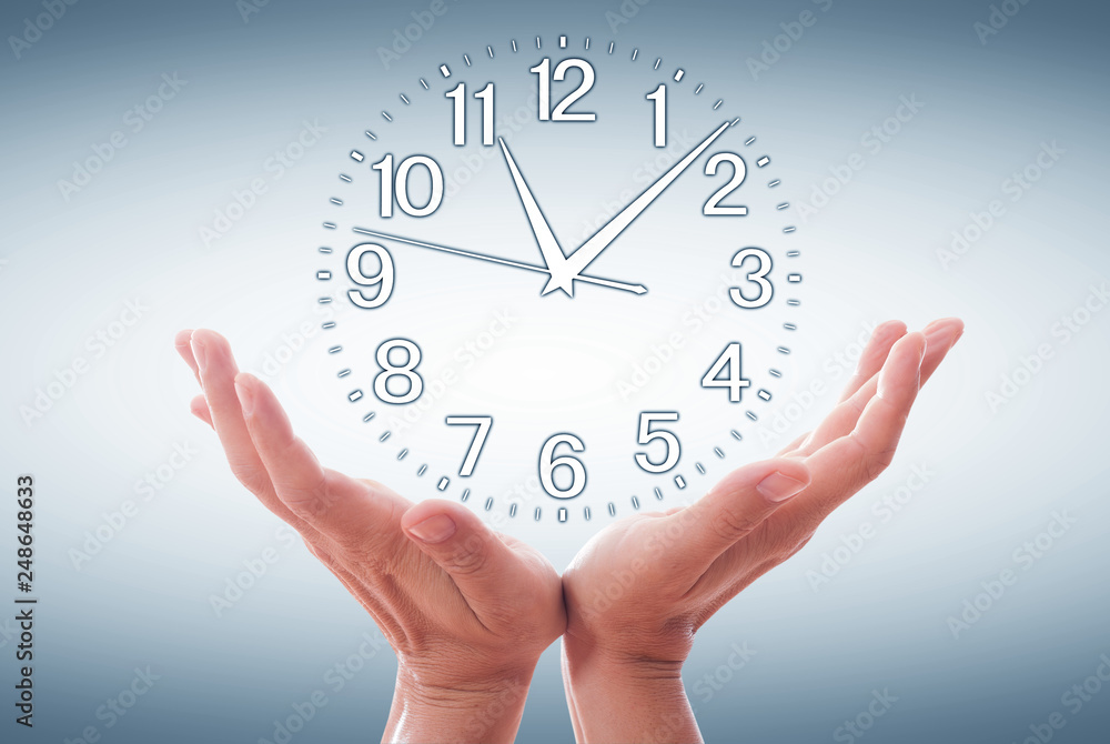 Human Hand Holding Clock Time isolated on white Human Hand Holding Clock Time isolated on white